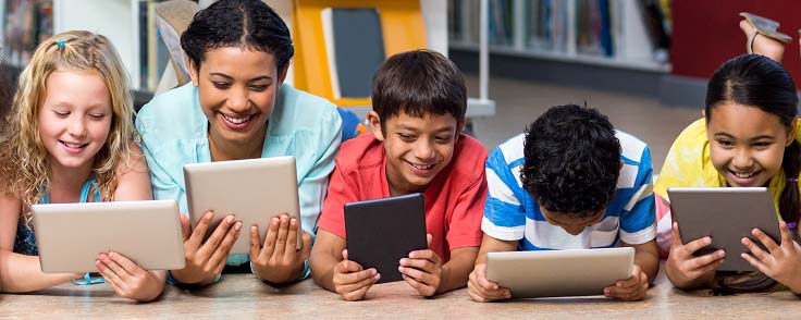 Teacher with students on devices