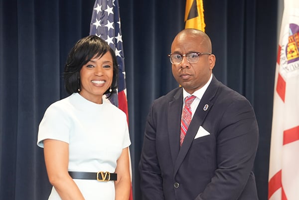 County Executive with Superintendent House in front of flags.jpg