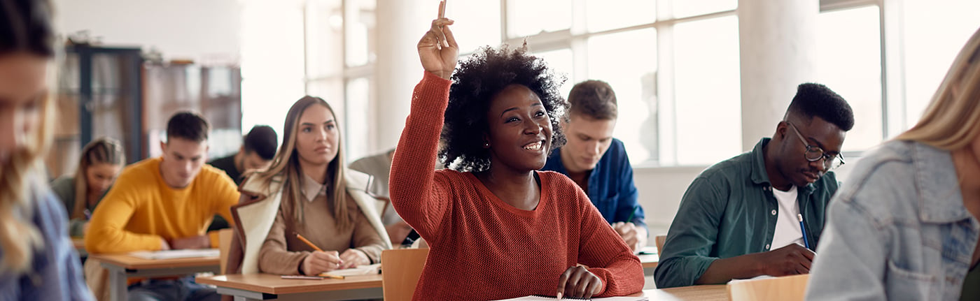 secondary-students-in-class-hand-raised