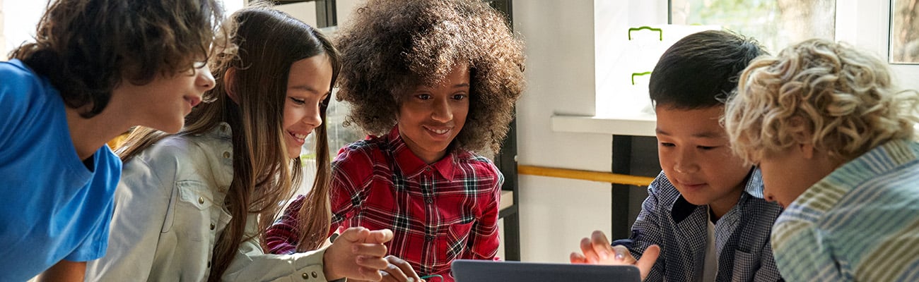 Middle school students working on a robot