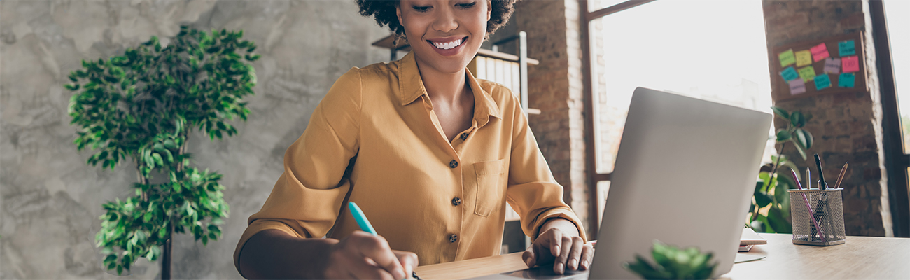 staff-parent-adult-female-on-computer-taking-notes-training