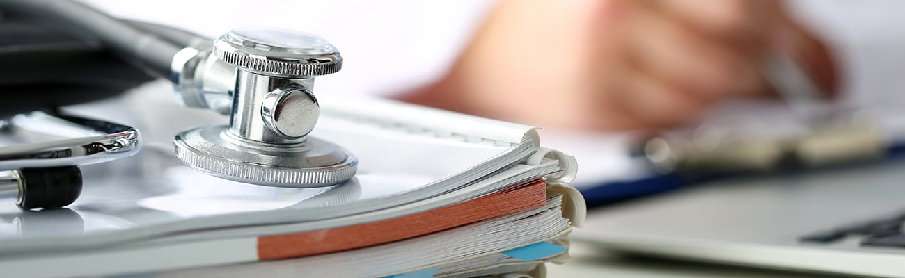 Stack of papers with a stethoscope